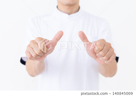 A middle-aged male acupuncturist/osteopath wearing a white coat. A middle-aged male acupuncturist/osteopath wearing a white coat. 140845009