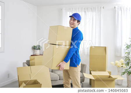 Portrait of a man working for a moving company. 140845083
