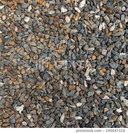 Square top view texture of numerous small multi colored gravel stones. And crushed rocks tightly packed together displaying a raw mineral pattern. For background and textured. 140845328