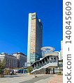 A scene in front of Takamatsu Station in Kagawa Prefecture, Japan, where there is a train station and a port. 140845609