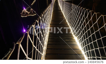 Nighttime Suspension Bridge Walkway Illuminating the Path Nighttime Suspension Bridge Walkway Illuminating the Path 140845676