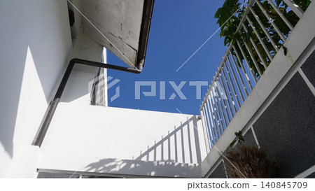 White Building and Blue Sky Minimalist Architecture White Building and Blue Sky Minimalist Architecture 140845709