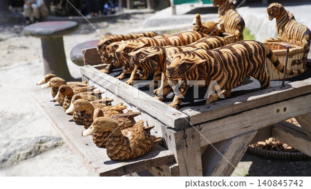 Hand Carved Wooden Tiger and Duck Figurines 140845742