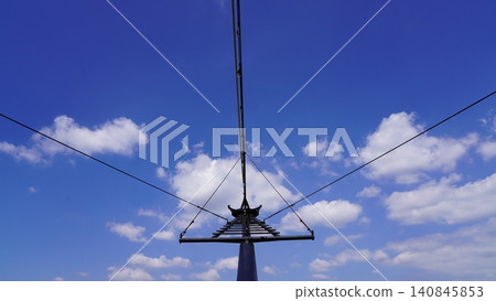 Ski Lift Structure Against Blue Sky and White Clouds Ski Lift Structure Against Blue Sky and White Clouds 140845853