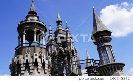 Whimsical Castle Towers Against a Blue Sky Whimsical Castle Towers Against a Blue Sky 140845872