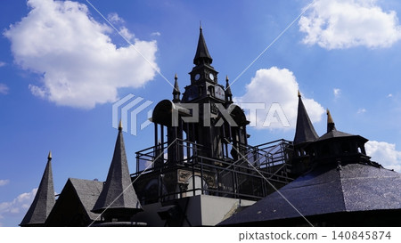 Detailed Clock Tower Under Blue Sky and White Clouds Detailed Clock Tower Under Blue Sky and White Clouds 140845874