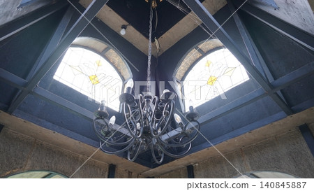 Architectural Interior with Chandelier and Stained Glass 140845887