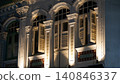 Ornate Building Facade with Windows and Shutters 140846337