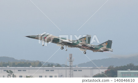 Japan Air Self-Defense Force F-1 fighter jets taking off in formation. 140846610
