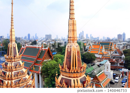 Aerial view cityscape of Bangkok with modern and old residential neighbourhood. Top view of Bangkok from Wat Ratchanaddaram Worawiha, Thailand. Topic of summer vacation, relaxing, travel, trip, cruise Aerial view cityscape of Bangkok with modern and old residential neighbourhood. Top view of Bangkok from Wat Ratchanaddaram Worawiha, Thailand. Topic of summer vacation, relaxing, travel, trip, cruise 140846733