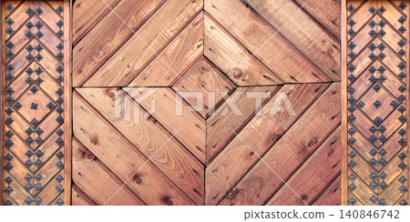 Texture of vintage wood board with decorative border with metal rivets. Vertical or horizontal retro background with old wooden plank and aged iron reinforcement. Copy space for text. Mock up template Texture of vintage wood board with decorative border with metal rivets. Vertical or horizontal retro background with old wooden plank and aged iron reinforcement. Copy space for text. Mock up template 140846742