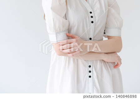 Close Up Fashion Detail of a White Cotton Dress with Buttons Close Up Fashion Detail of a White Cotton Dress with Buttons 140846898
