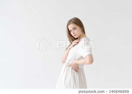 Romantic Young Woman in a White Cotton Dress Soft Feminine Portrait Romantic Young Woman in a White Cotton Dress Soft Feminine Portrait 140846899