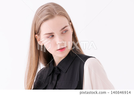 Pensive Young Woman Looking Down in a Black Jumpsuit Studio Portrait Pensive Young Woman Looking Down in a Black Jumpsuit Studio Portrait 140846914