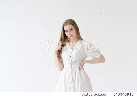 Friendly Young Woman in a White Dress Feminine Lifestyle Portrait Friendly Young Woman in a White Dress Feminine Lifestyle Portrait 140846916