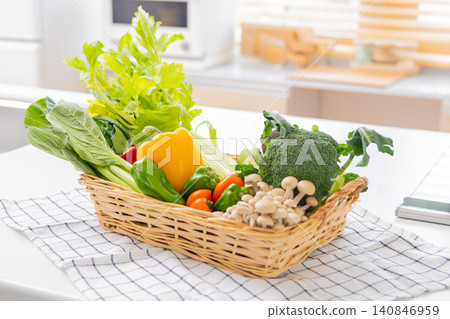 A basket of vegetables placed in the kitchen A basket of vegetables placed in the kitchen 140846959