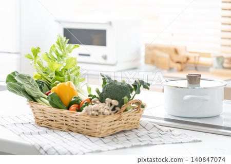 A basket of vegetables placed in the kitchen 140847074