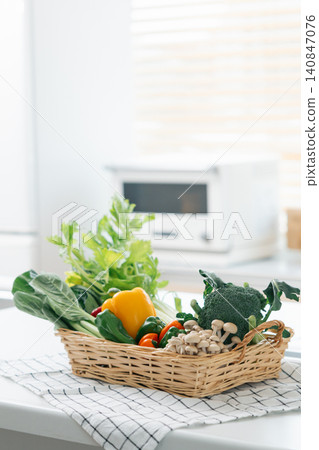 A basket of vegetables placed in the kitchen 140847076