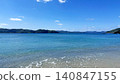 The emerald green sea and white sandy beach of Yadori Beach in Setouchi Town, Amami Oshima. 140847155