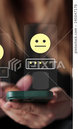 Vertical video Woman holds smartphone giving good review at cafe. Close up on female hand holding smartphone rating of the quality of service,store, service and social networks. Graphic animation. 140847176