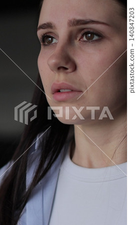 Vertical video Close up of young woman suffering from depression. Upset frustrated lonely lady thinking of grief troubled. Vertical video Close up of young woman suffering from depression. Upset frustrated lonely lady thinking of grief troubled. 140847203
