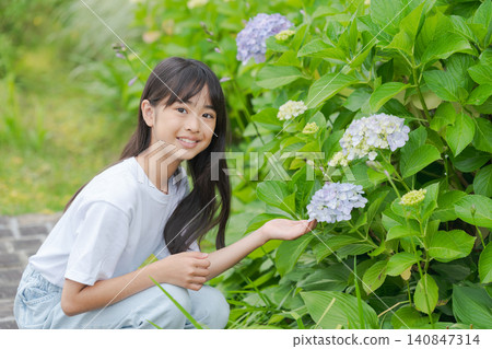 A girl watching hydrangea A girl watching hydrangea 140847314