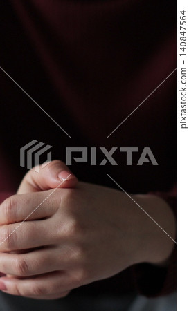 Vertical video Young woman suffering from depression. Woman hands, fidget and pray, signaling mental battle. Emotional relationship and marriage crisis. Vertical video Young woman suffering from depression. Woman hands, fidget and pray, signaling mental battle. Emotional relationship and marriage crisis. 140847564