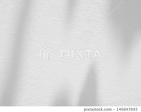 Abstract shadow of leaves on white concrete wall background Abstract shadow of leaves on white concrete wall background 140847693