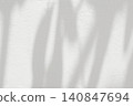 Leaf shadow and light on white concrete wall background 140847694