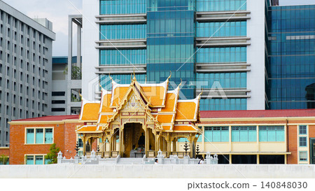 traditional Thai temple building contrasted against modern skyscrapers in the background, symbolizing the harmony between Thailand's rich cultural heritage and contemporary urban development traditional Thai temple building contrasted against modern skyscrapers in the background, symbolizing the harmony between Thailand's rich cultural heritage and contemporary urban development 140848030