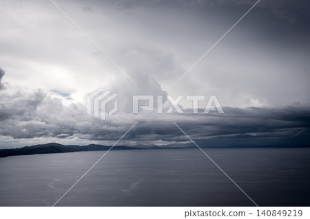 View of Lake Titicaca from Amantani Island under stormy clouds View of Lake Titicaca from Amantani Island under stormy clouds 140849219