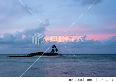 Sunset over a tropical motu on Tikehau Atoll, French Polynesia Sunset over a tropical motu on Tikehau Atoll, French Polynesia 140849225