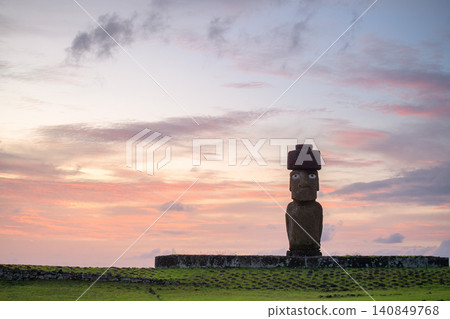 Majestic moai statue on easter island chile stands peaceful in sunset sky Majestic moai statue on easter island chile stands peaceful in sunset sky 140849768