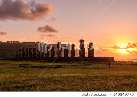 Awe inspiring peaceful sunset behind moai statue on Easter Island Chile Awe inspiring peaceful sunset behind moai statue on Easter Island Chile 140849770