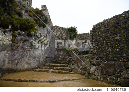 Peaceful ancient stone stair at machu picchu ruin in peru evoking awe Peaceful ancient stone stair at machu picchu ruin in peru evoking awe 140849786