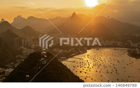 Serene sunset over mountain cityscape and bay of Rio de Janeiro Brazil beautiful landscape view with many boats Serene sunset over mountain cityscape and bay of Rio de Janeiro Brazil beautiful landscape view with many boats 140849789