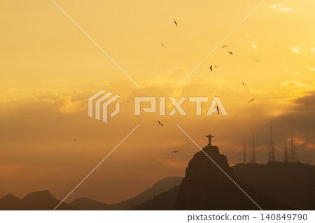 Majestic golden sunset sky over Christ Redeemer statue famous landmark in Rio de Janeiro Brazil serene mountain view Majestic golden sunset sky over Christ Redeemer statue famous landmark in Rio de Janeiro Brazil serene mountain view 140849790