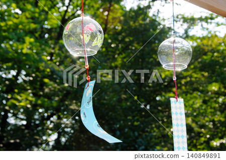 Wind chimes swaying in the wind Wind chimes swaying in the wind 140849891