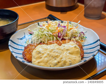 A classic chicken nanban set meal with a generous portion of rice, miso soup, and salad. A classic chicken nanban set meal with a generous portion of rice, miso soup, and salad. 140849895