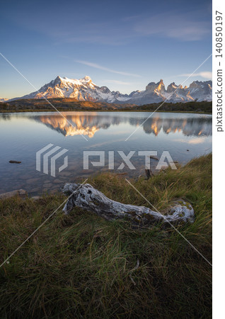 Patagonia mountain lake with reflection and grass foreground Patagonia mountain lake with reflection and grass foreground 140850197