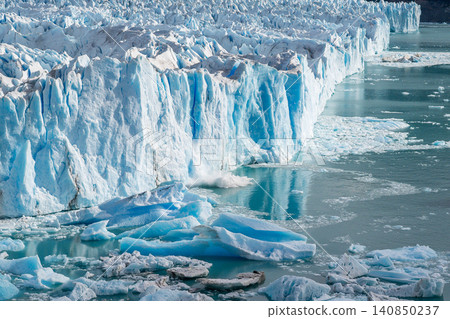 Perito Moreno glaciers, blue ice cliff above cold water, dramatic frozen glacier landscape 140850237