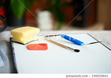 Art tools arranged on blank canvas for DIY textured art Art tools arranged on blank canvas for DIY textured art 140850601