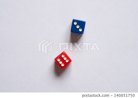 Blue and red dice on a white background Blue and red dice on a white background 140851750
