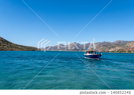 Tourist Boat Cruising Mirabello Bay in Elounda Crete Tourist Boat Cruising Mirabello Bay in Elounda Crete 140852248