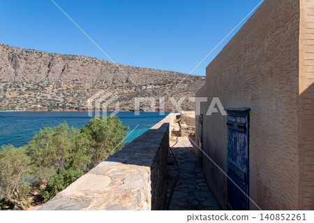 Spinalonga Island Fortification Wall Facing Blue Sea in Crete Spinalonga Island Fortification Wall Facing Blue Sea in Crete 140852261