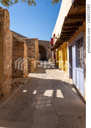 Spinalonga Island Vertical Street View with Colorful Building Facades Spinalonga Island Vertical Street View with Colorful Building Facades 140852265