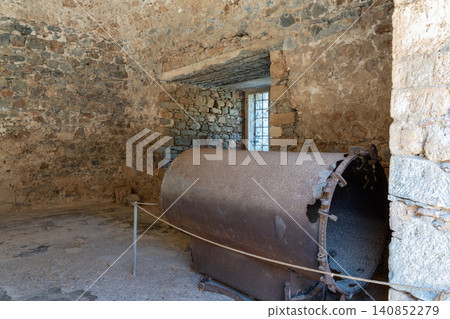 Rusty Machinery Inside Historical Stone Building on Spinalonga Island Rusty Machinery Inside Historical Stone Building on Spinalonga Island 140852279