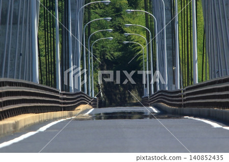 Summer roads where mirages occurred Summer roads where mirages occurred 140852435