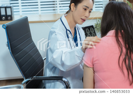 Doctor's hand reassuring woman patient. Doctor's hand reassuring woman patient. 140853033