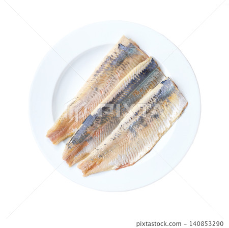 herring fillet on a white plate isolated on a white background, top view. 140853290
